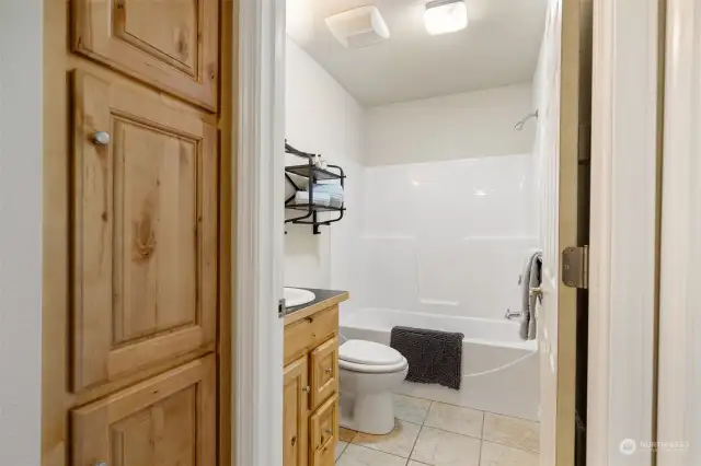 2nd bath also with lovely hickory cabinetry