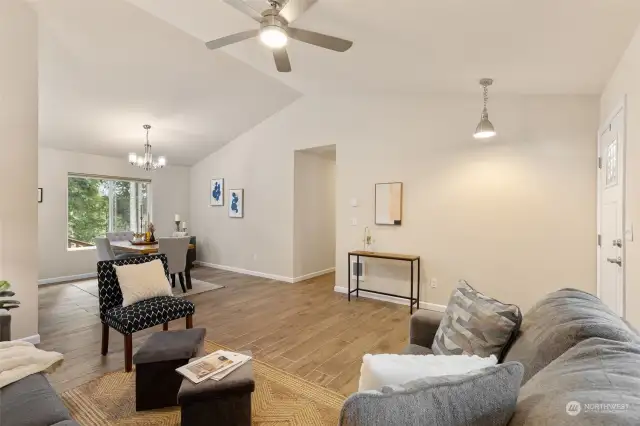 vaulted ceilings and practical ceiling fan grace this functional space.