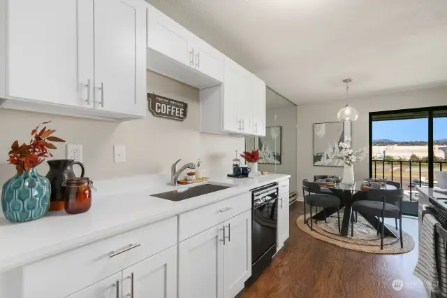 Beautiful quartz counters offer ample work space.