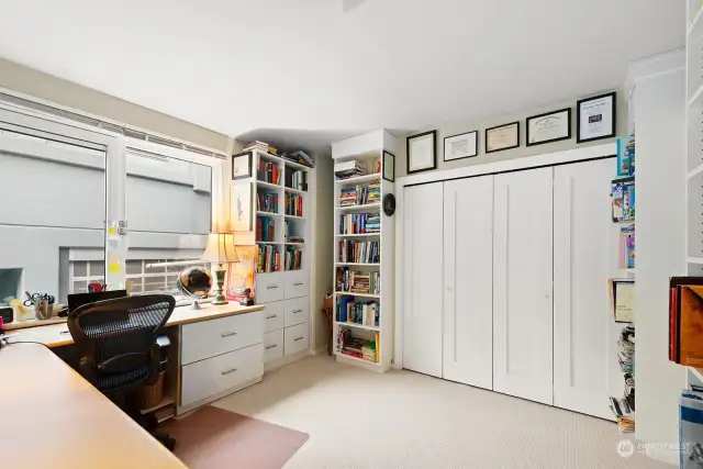 The Guest Bedroom has been used by the Seller as a second Home Office. The Desk and Shelving could easily come out to revert back to a traditional Guest Bedroom. This room has an Entry Door off the Living Room, as well as, off the Hallway from the Kitchen.