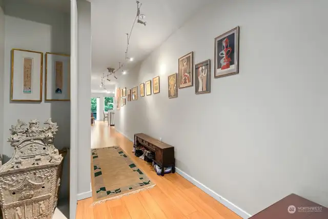 Long Entry Hall with Bamboo Floors would make perfect Gallery for Artwork or Photos.