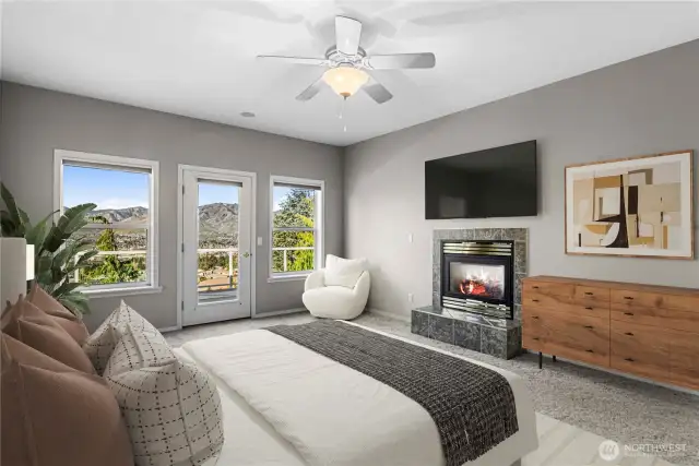 ambiance in primary bedroom suite with relaxing gas fireplace and view.