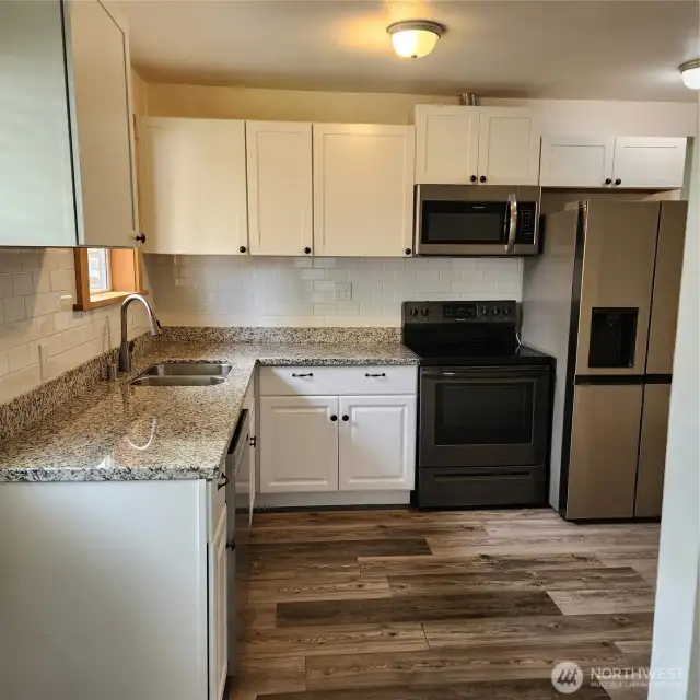 All kitchen appliances stay!  Flooring, cabinets, counter tops are all newer.