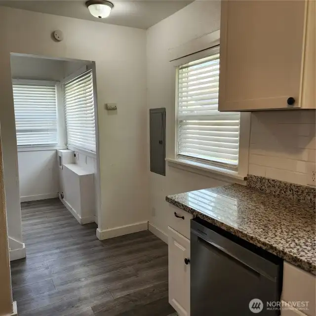 Another angle of the kitchen leading to the back door and laundry room