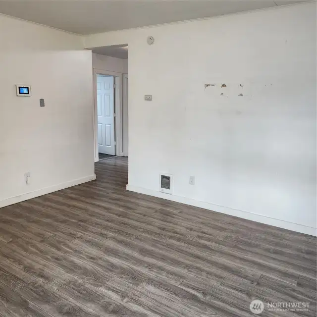 Another angle of the living room area leading to the kitchen