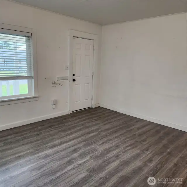 Another angle of living room area, this home just need your personal design of paint