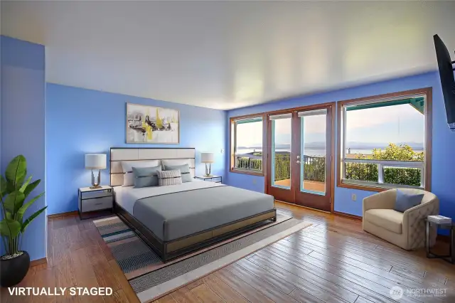 The primary bedroom w/ more views & French doors out to the deck. Virtually staged.