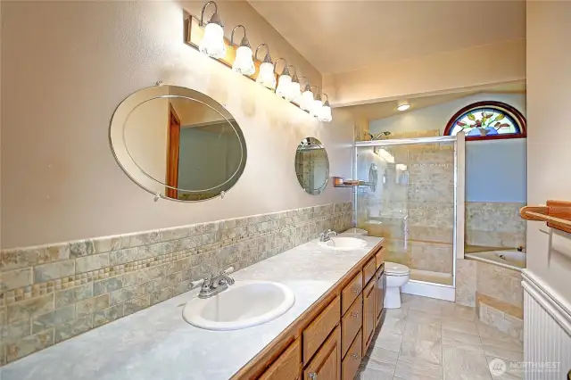 Primary ensuite w/ double vanity & tons of storage.