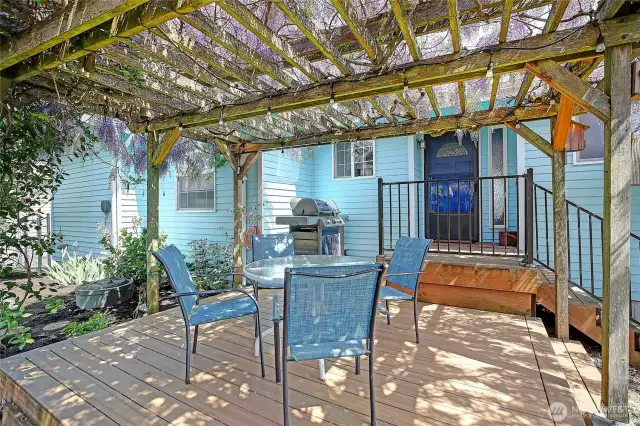 How inviting is the deck under the Pergola of Wisteria.