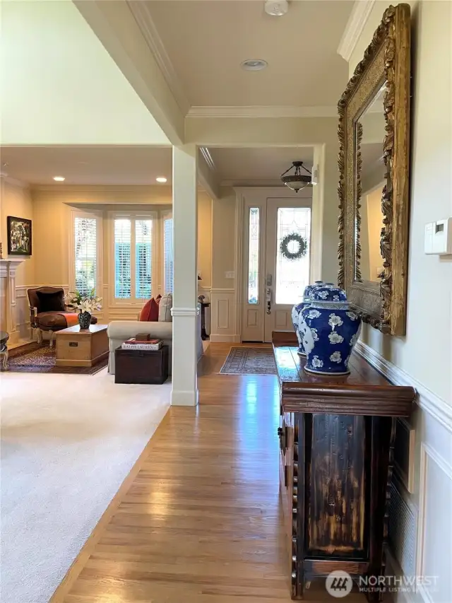 Main floor hallway with hardwood floor.