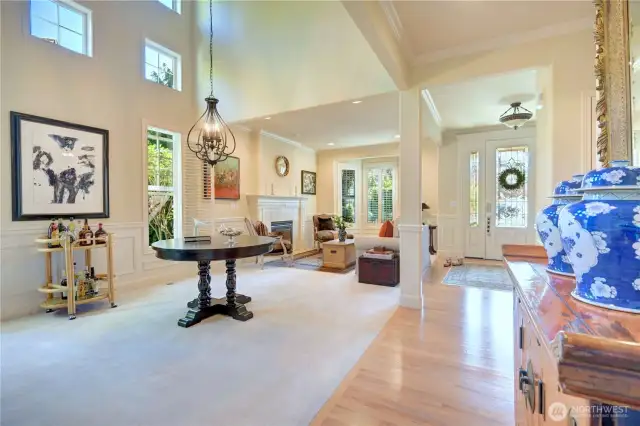 Main floor from the hallway with hardwood floor open floor plan with formal dining room and living room.