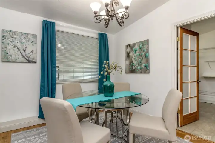 This inviting eating area is the perfect spot to enjoy meals and create lasting memories. With plenty of natural light streaming through the windows, it feels bright and welcoming throughout the day. The open layout seamlessly connects to the kitchen, making it ideal for both casual breakfasts and sit-down dinners. Warm flooring and a comfortable flow give this space a cozy yet functional feel—an everyday gathering place you’ll love.