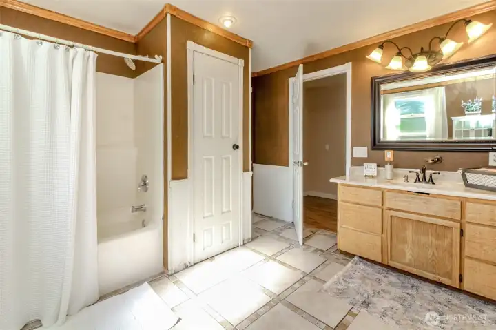 Main Floor Bath connects to second Primary Bedroom.