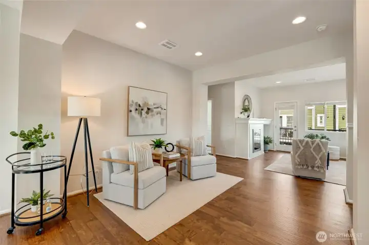 The main living area is designed for comfort and entertaining. A spacious living room with oversized windows and durable flooring anchors the space, while the adjacent dining area is perfectly positioned for everyday meals or hosting friends and family.