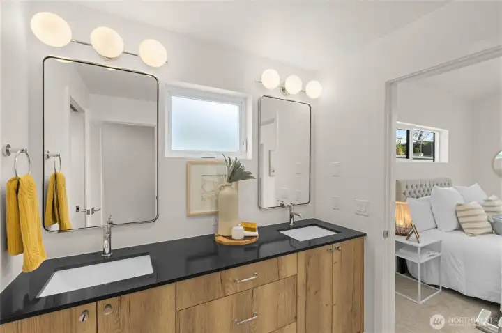 Sophisticated bathroom finished with designer tile a large vanity and soaking tub evokes spa-like comfort.