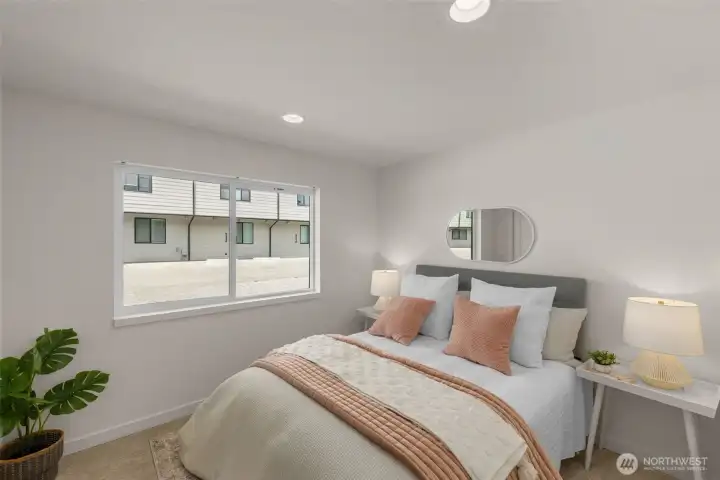 Bright secondary bedroom invites creativity as a serene guest room a personal library or a cozy studio.