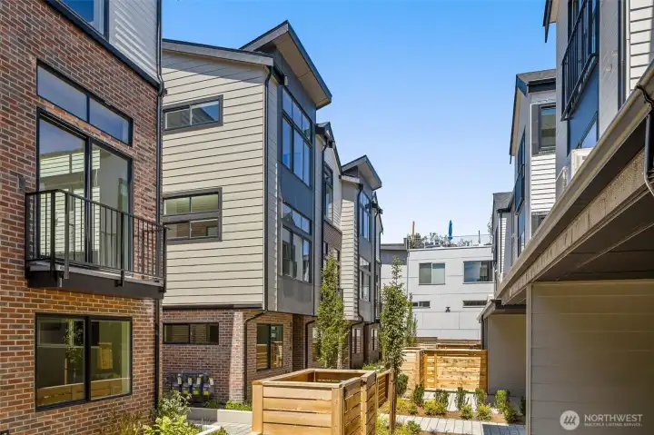 This view captures the bold architecture and pedestrian-friendly scale of this vibrant neighborhood setting.