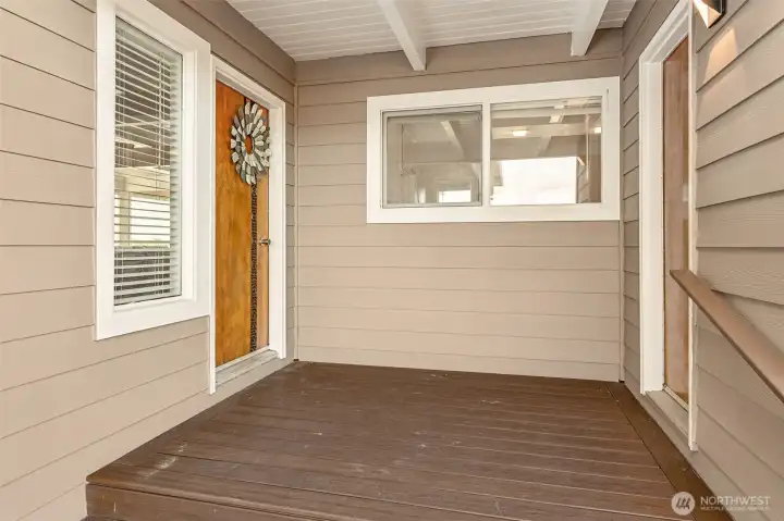Covered entry with access to the utility room.