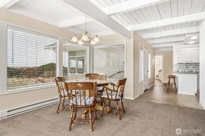 Windows, windows, windows! That gorgeous white wood ceiling carries through the entire house.