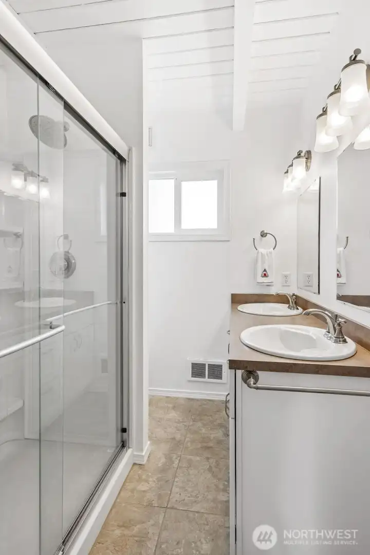 Guest bath has double;e vanity sinks.