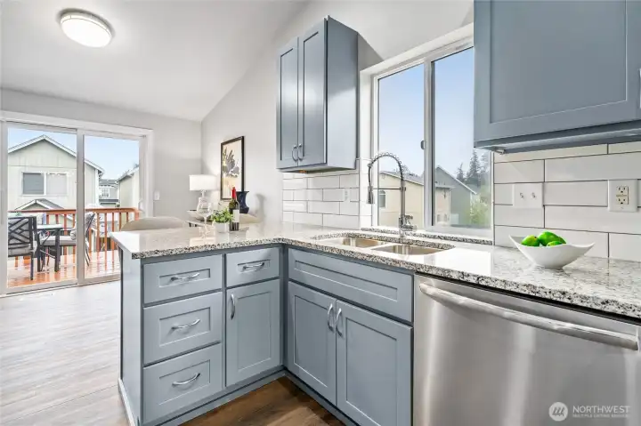 Kitchen Open to Eating Nook with Sliding Door to Deck