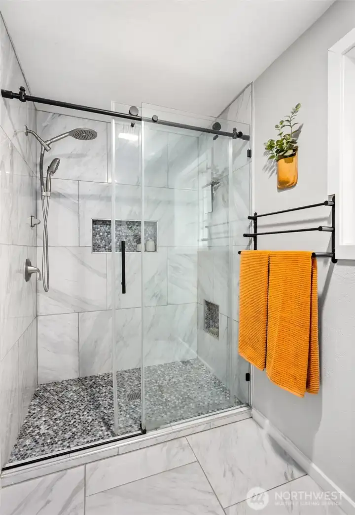 Custom walk in shower in primary bathroom.