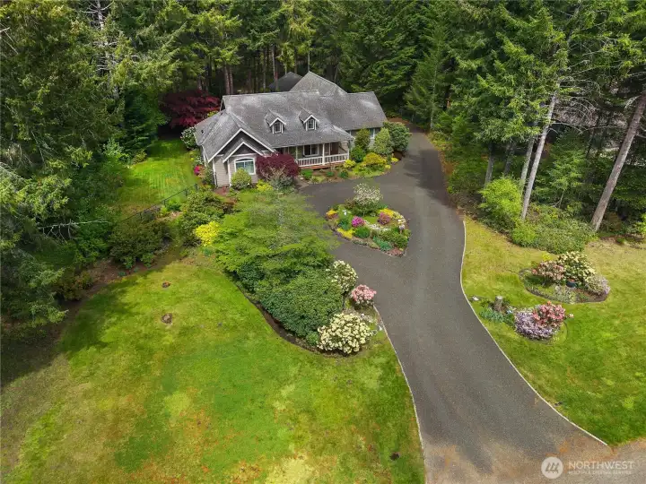 Custom built home on acreage with shop and fully fenced.