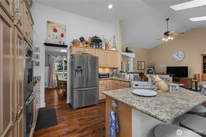 Custom countertops, double oven, stainless steel appliances, this kitchen is made for a chef.