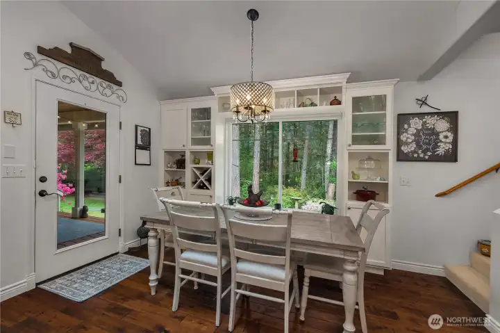 Kitchen nook looks towards the backyard and door takes you to the covered deck.