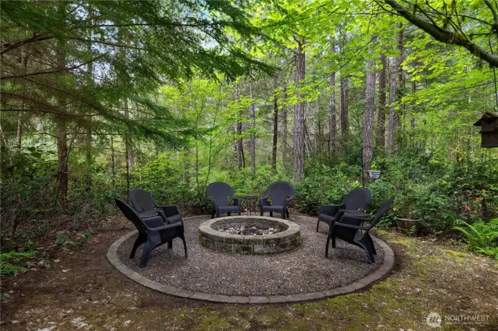 firepit with trail to the horseshoe pit and the shop.