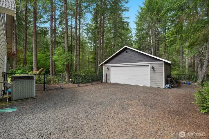 View of the shop, driveway connects straight to the street.