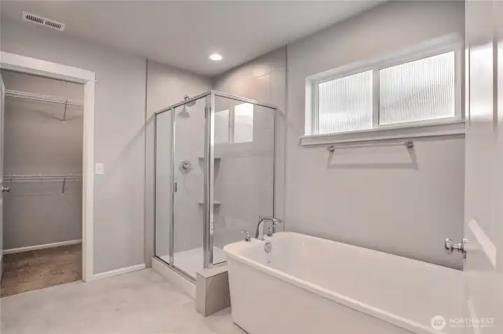 Glass shower wall and doo and freestanding tub Glass shower wall and doo and freestanding tub