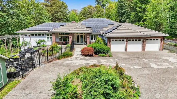 Beautiful landscaping & circular driveway welcome you to this expansive, estate-style home. Beautiful landscaping & circular driveway welcome you to this expansive, estate-style home.