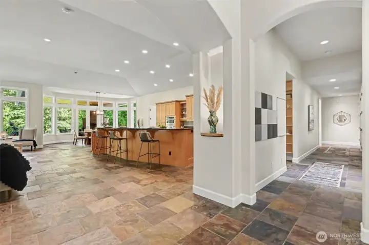 Arched doorways and high ceilings frame the exquisite open kitchen/living/dining area, elevating your living and entertaining experience Arched doorways and high ceilings frame the exquisite open kitchen/living/dining area, elevating your living and entertaining experience