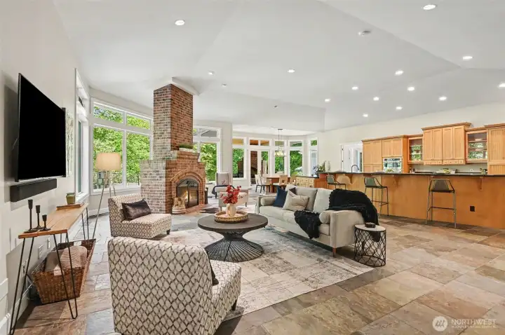 Wood burning fireplace anchors the living room providing a cozy gathering space and focal point Wood burning fireplace anchors the living room providing a cozy gathering space and focal point