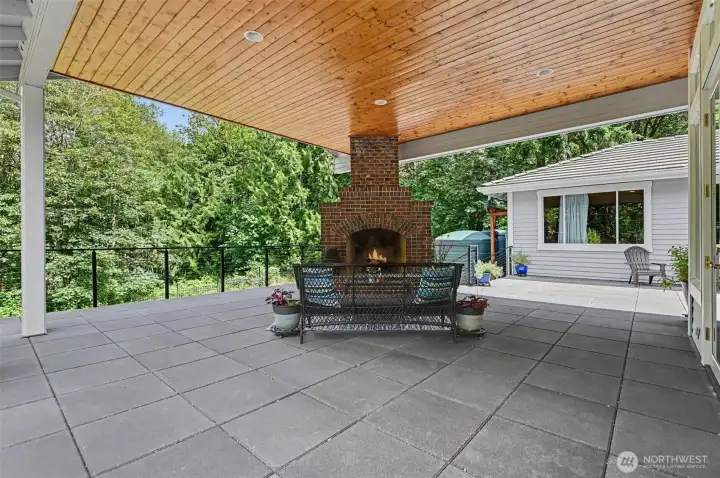 Expansive, covered deck with plenty of sitting areas and a center fireplace to enjoy indoor/outdoor living all year long. Expansive, covered deck with plenty of sitting areas and a center fireplace to enjoy indoor/outdoor living all year long.