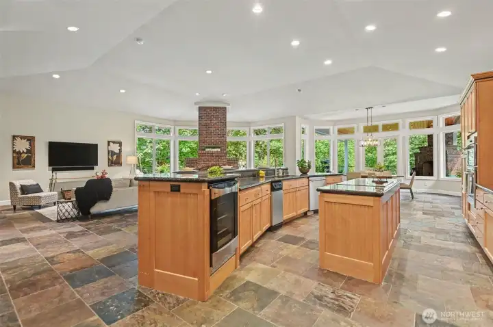 A true chef’s kitchen with loads of counterspace, butler’s pantry, second oven wine refrigerator, trash compactor and walk-in pantry and endless storage. A true chef’s kitchen with loads of counterspace, butler’s pantry, second oven wine refrigerator, trash compactor and walk-in pantry and endless storage.