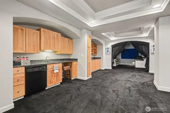 Wet bar and dishwasher just outside your home theater Wet bar and dishwasher just outside your home theater