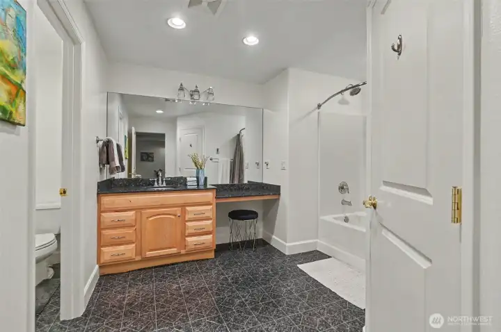 Full bath on lower level next to 4th bedroom. Full bath on lower level next to 4th bedroom.