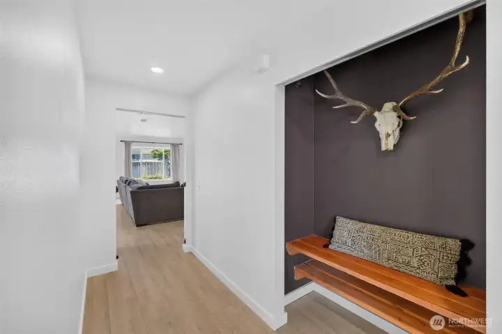 Innovative bench and shoe storage is built in just inside the front door