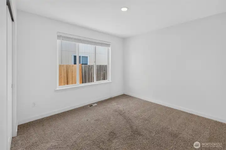 Just off the front hallway, this first bedroom is separate from all the other bedrooms - perfect home office or playroom - anything you want to have a little bit away from the other bedrooms