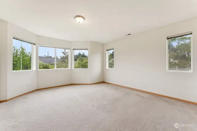 Extra large Primary Bedroom lot of natural light and view of the park.