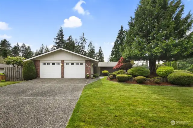 Well cared for landscape and fenced yard.