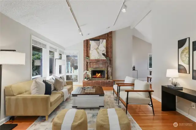 Lots of natural light, vaulted ceilings, & wood burning fireplace