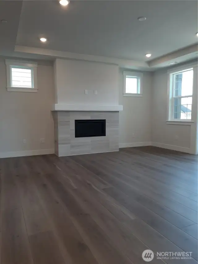 Gas fireplace with beautiful tilework warms the great room.