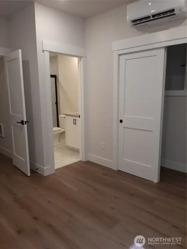 Lower level bedroom with ensuite bath is perfect for guests.