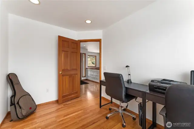 Office with hardwood floors.
