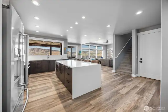Kitchen with quartz Waterfall edge island, stunning cabinets and premuim appliances.