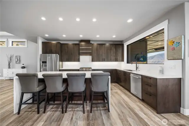 Kitchen with quartz Waterfall edge island, stunning cabinets and premuim appliances.