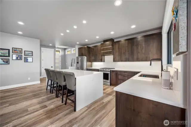 Kitchen with quartz Waterfall edge island, stunning cabinets and premuim appliances.